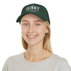 Person wearing a green cap with 'The Skinny' text on a white background