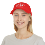 Person wearing a red cap with 'The Skinny' text on a white background