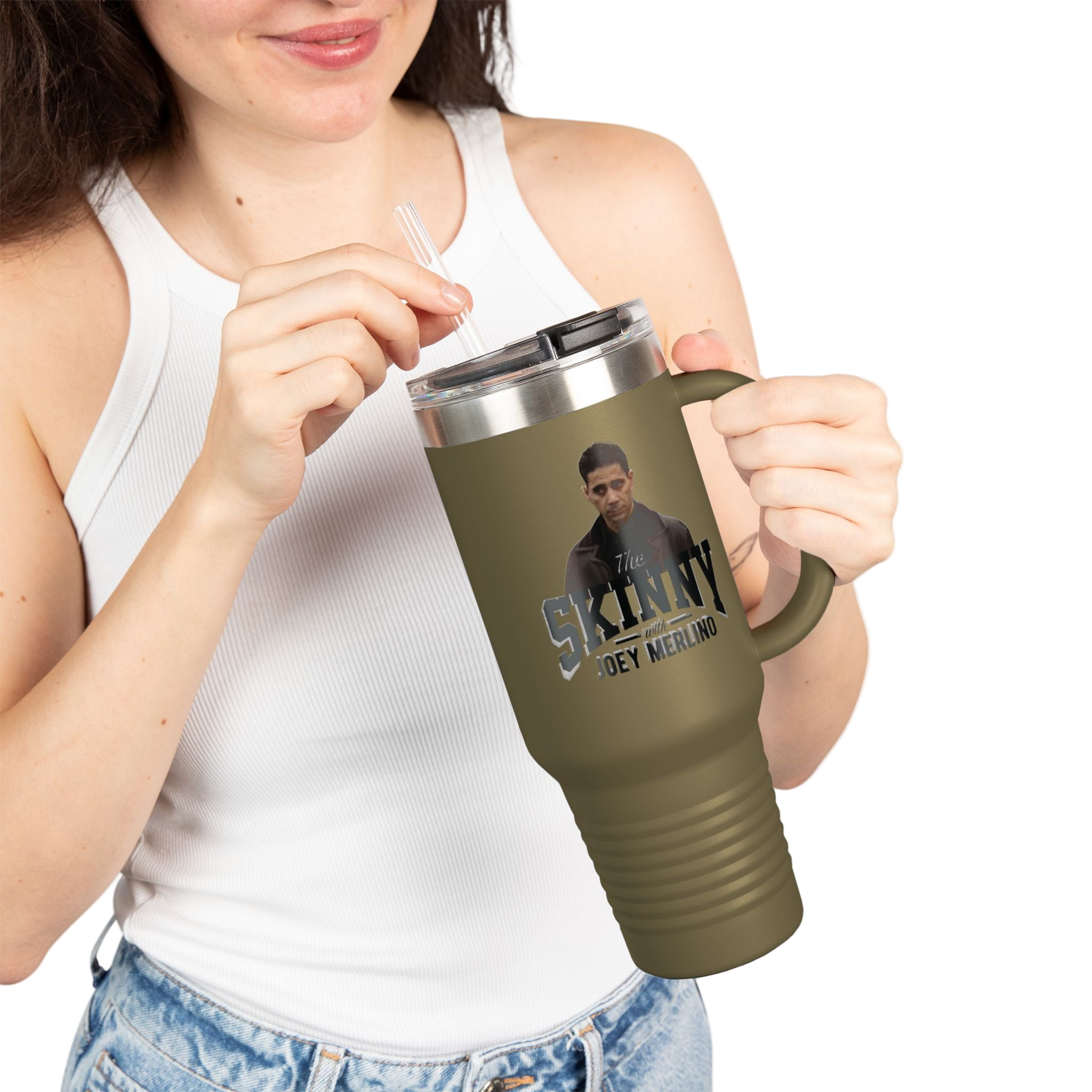 Person holding a green travel mug with a graphic design on a white background