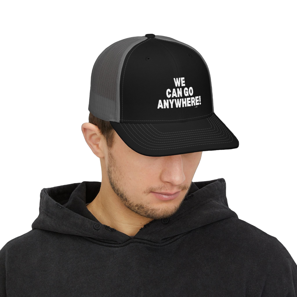 Person wearing a black and gray cap with 'WE CAN GO ANYWHERE!' text on a white background