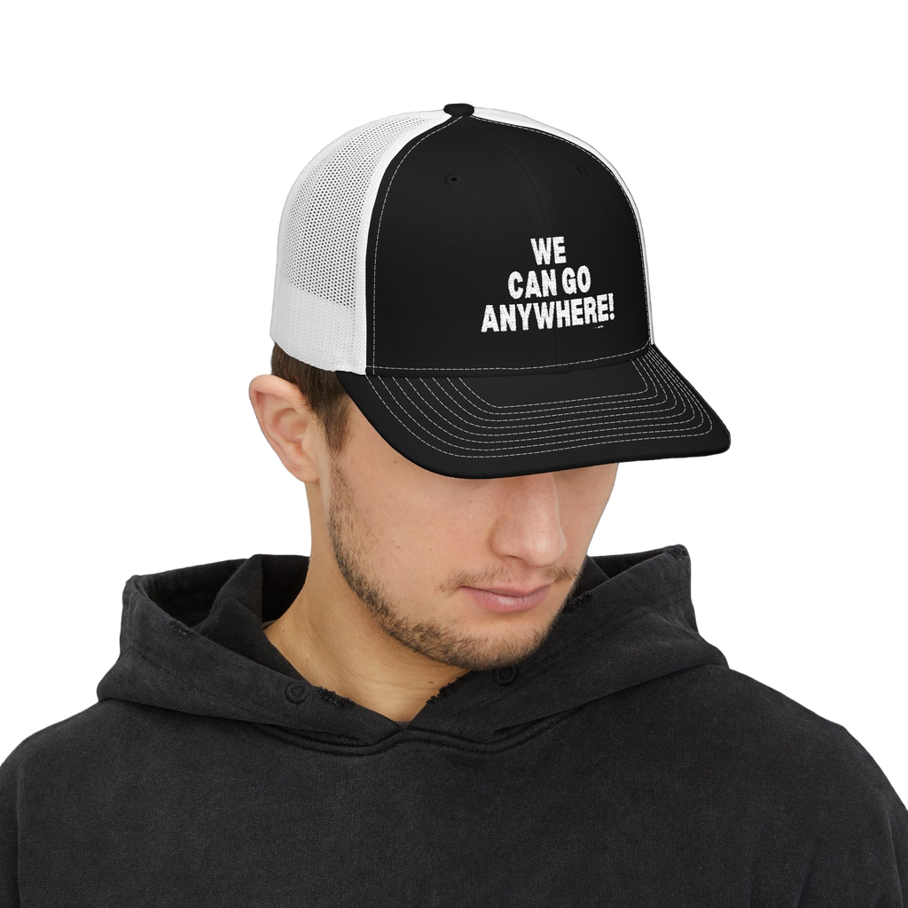 Person wearing a black and white cap with 'WE CAN GO ANYWHERE!' text on a white background