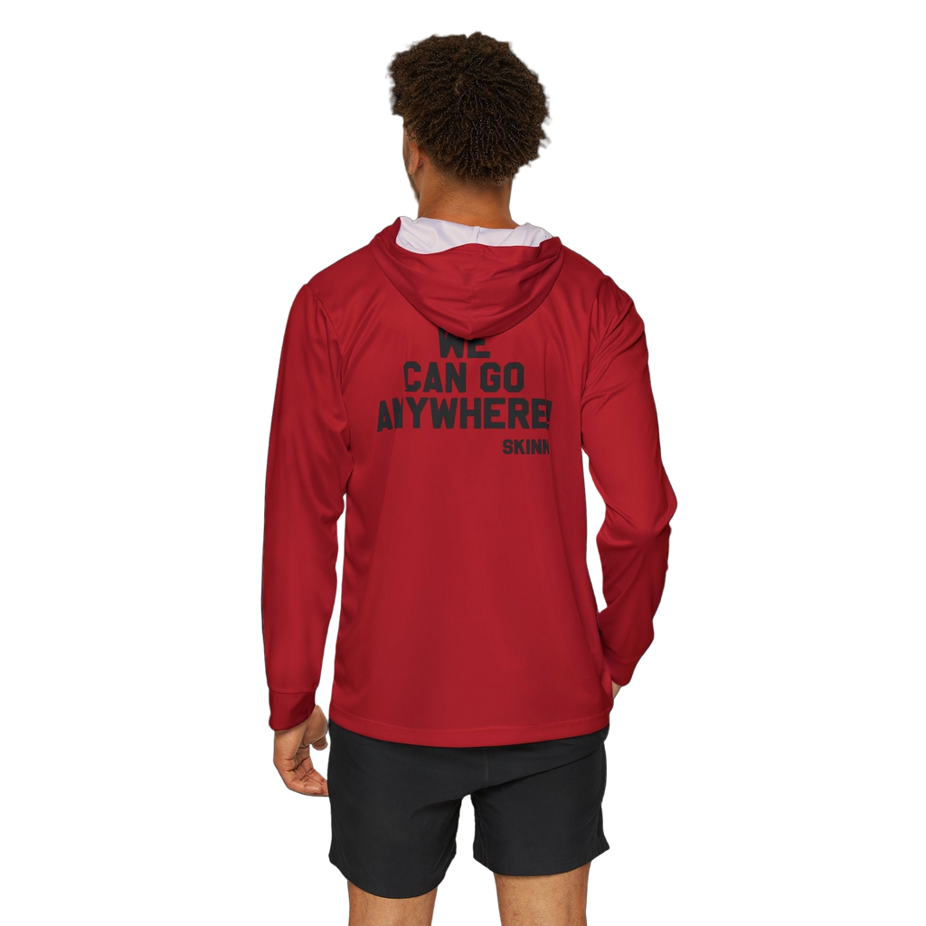 Person wearing a red hoodie with text on the back, standing against a white background