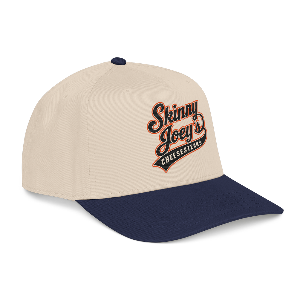 Beige and navy cap with 'Skinny Joey's Cheesesteaks' logo on a white background