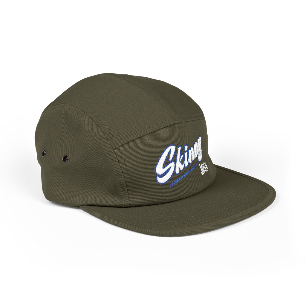 Green cap with 'Sking' logo on a white background