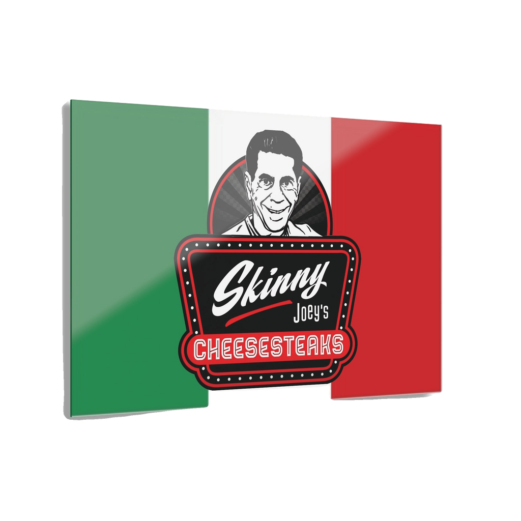 Flag with 'Skinny Joey's Cheesesteaks' logo and a person's face on a white background